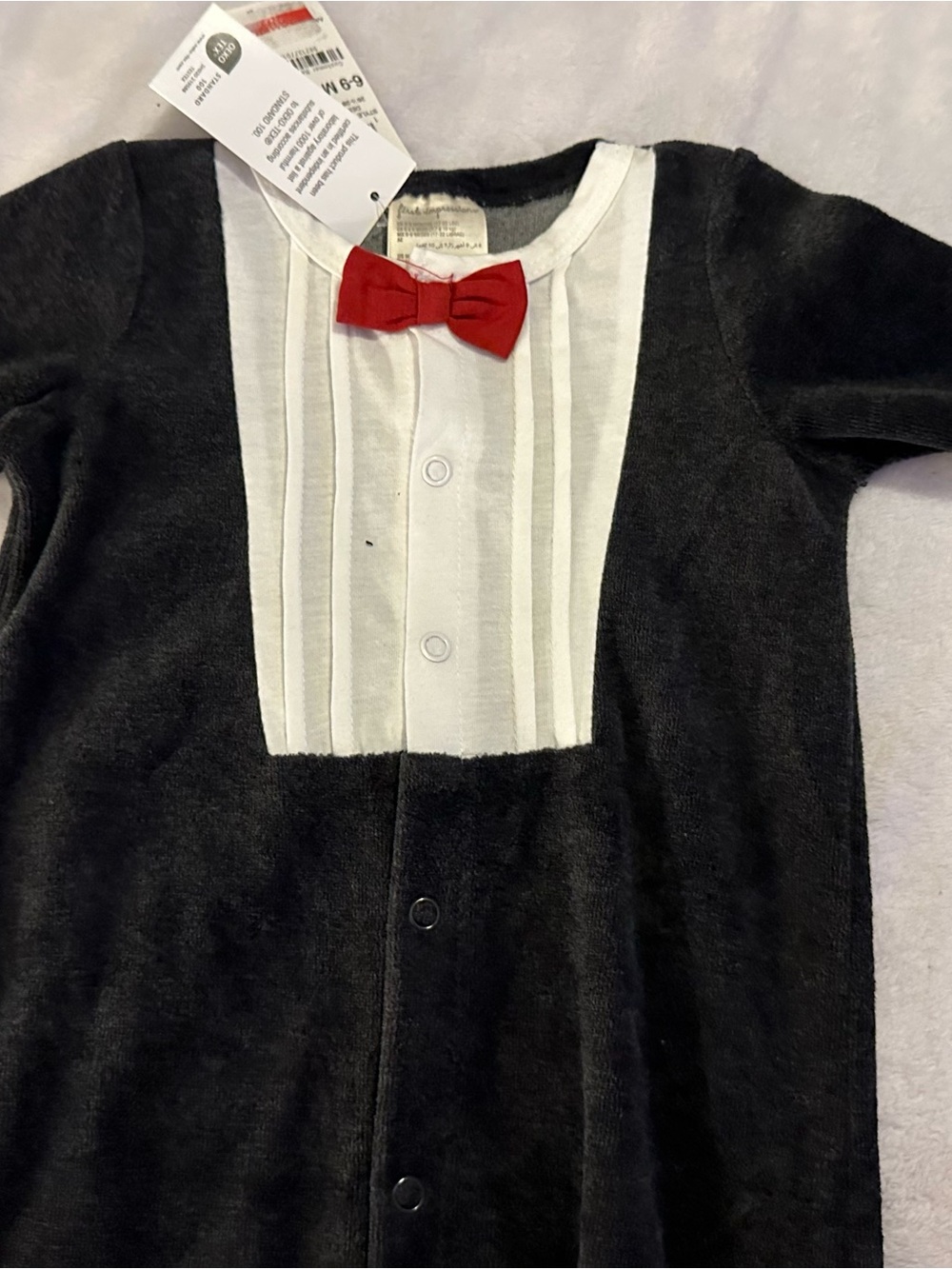 First Impressions Black and White Tuxedo One-Piece with Red Bow